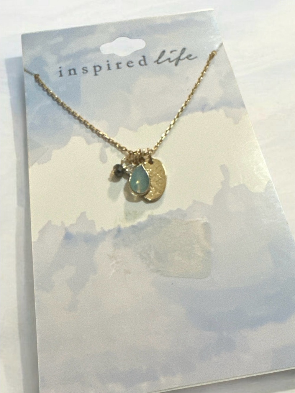 Inspire Gold Necklace with Aqua Teardrop Charm
1931